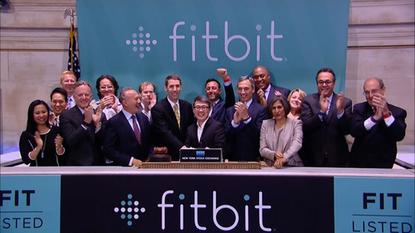 Executives of FitBit ring the opening bell and celebrate the start of trading of FitBit stock at the New York Stock Exchange on June 18, 2015.