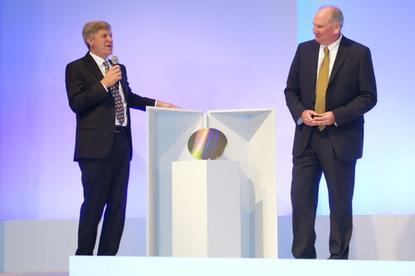 Rob Crooke, senior vice president and general manager of Intel's Non-Volatile Memory Solutions Group, left, and Micron CEO Mark Durcan unveiled the first wafer of the 3D XPoint memory technology the companies co-developed, in San Francisco on July 28, 2015.
