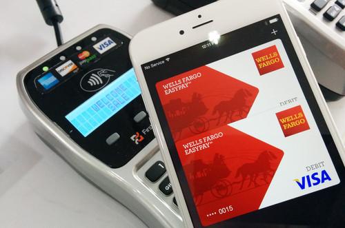An iPhone 6 being used to make an NFC payment via Apple Pay